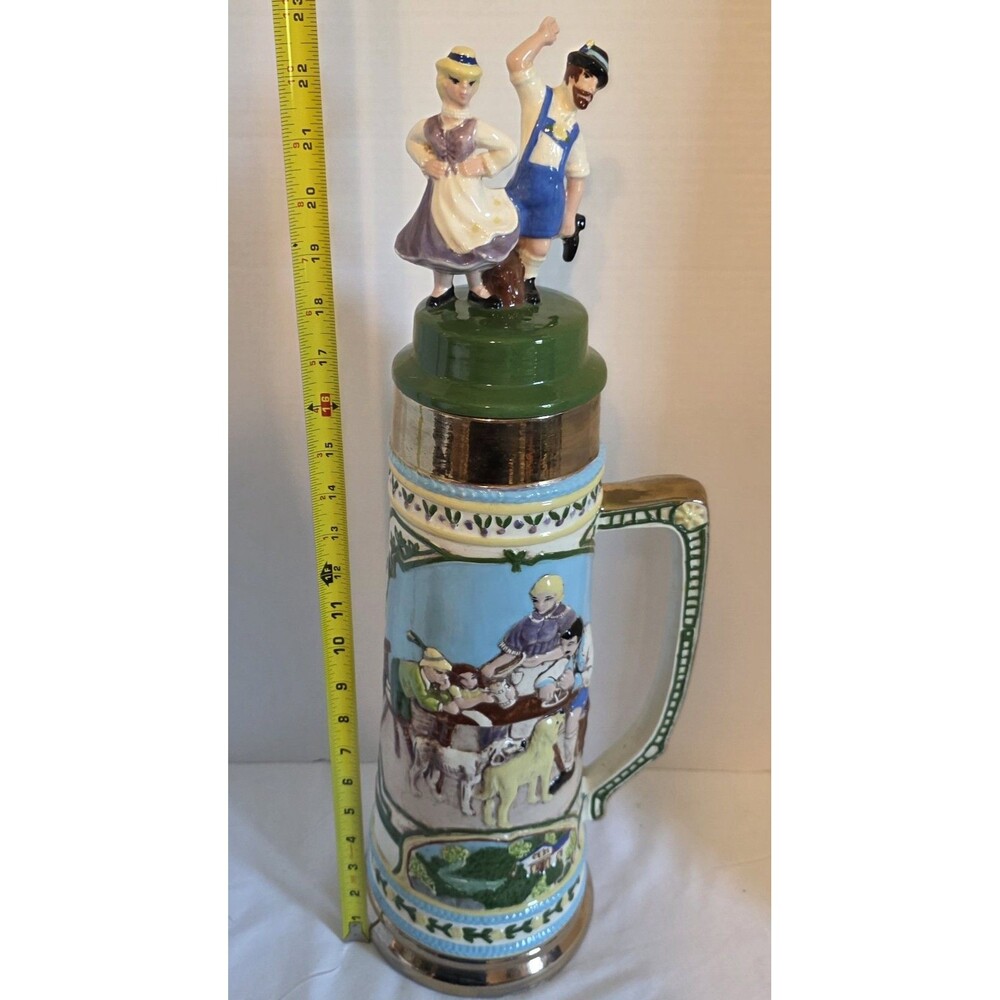 23" Lg Decorative German Beer Stein a couple in traditional attire and a tavern